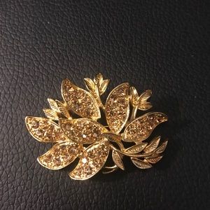 Gold toned broach